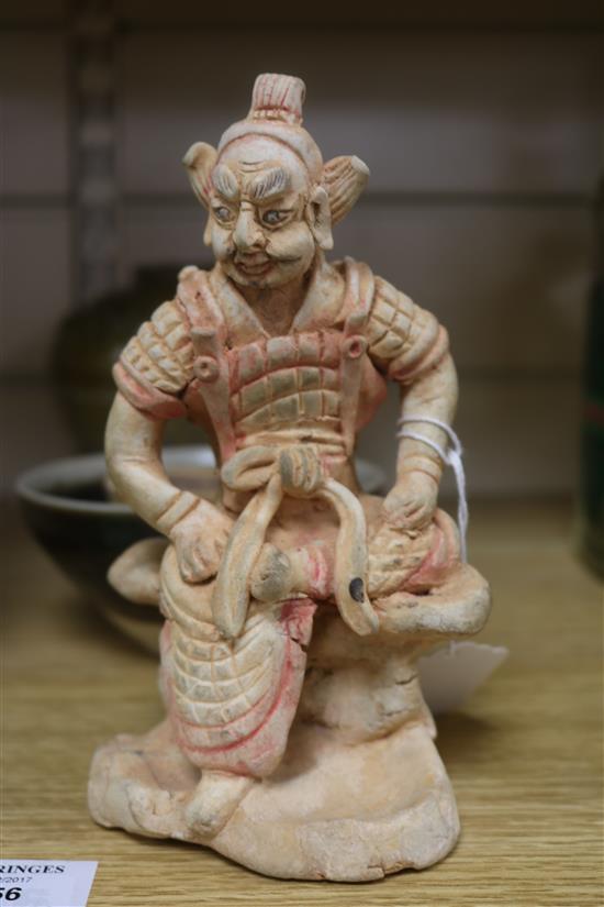 A Chinese green glazed jar, two other pottery jars and a pottery figure